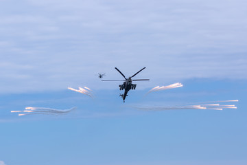 Two military helicopters in sky