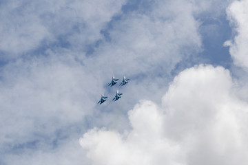 Four war jet planes in sky