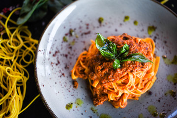 delicious italian spaghetti bolognese with minced beef sauce, tomatoes, carrots & fresh basil 