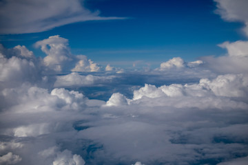 Obraz premium beautiful sky and clouds from window of plane