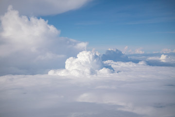 beautiful sky and clouds from window of plane