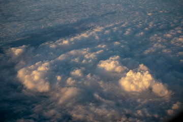 beautiful sky and clouds from window of plane