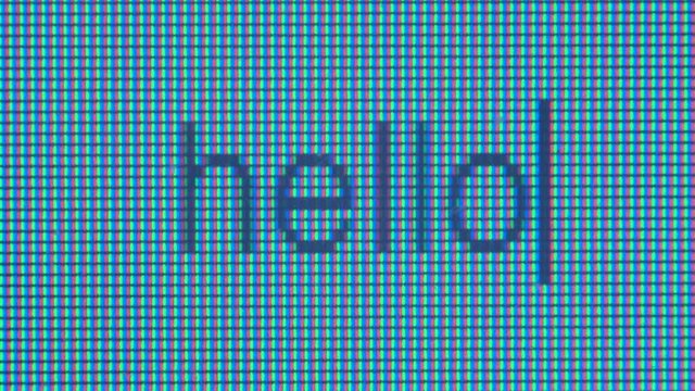 Writing the word Hello on a laptop screen