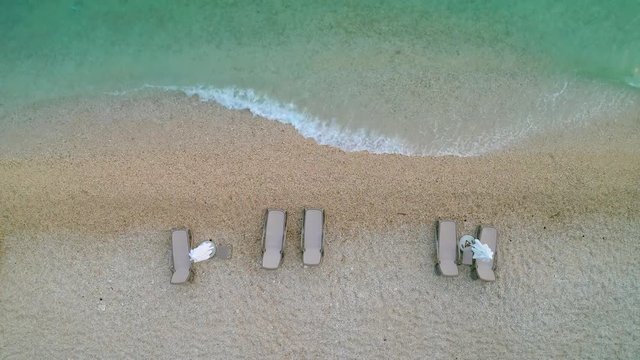 Aerial shot of the sun loungers and beach umbrellas on the beach