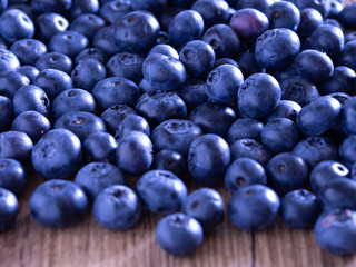 Blueberry berry on a wooden table. Summer and vitamins