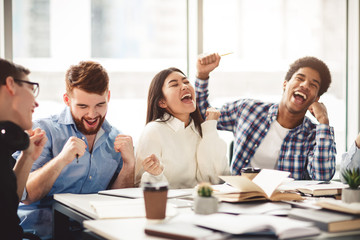 Motivated students celebrating finished learning for test
