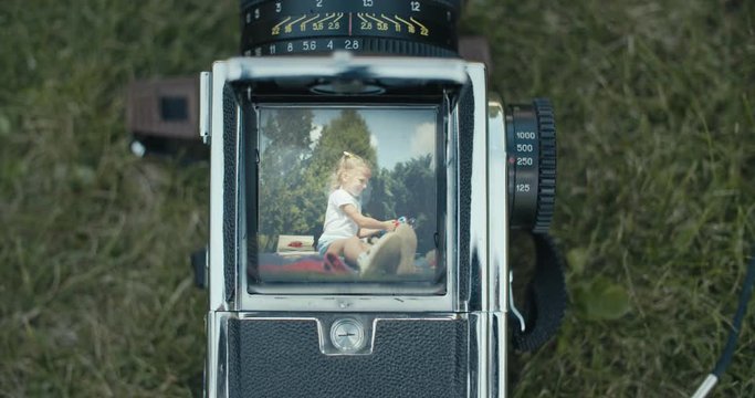 girl's portrait with old camera