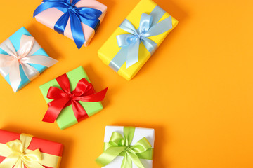 gifts on a colored background top view. Holiday, giving presents, birthday.