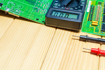 Services for the production of electronics and repair on a wooden background.