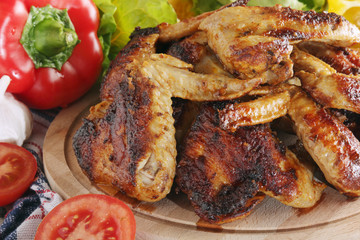 Chicken wings barbecue with different vegetables	