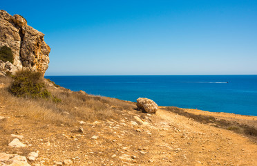  colorful pristine nature of the coast of Cyprus cape cavo greco with clear blue water and yellow rocks