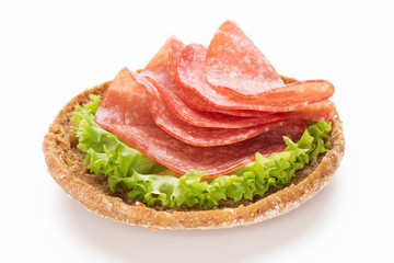 Sandwich with salami sausage on white background.