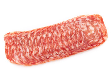 Salami slices on white background.
