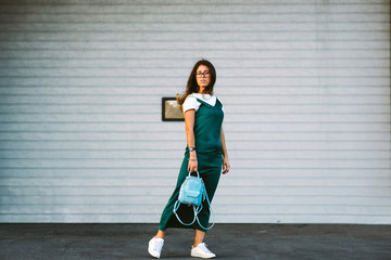 Obraz premium Beautiful young woman smiling cheerful walking on the street, casual pretty girl at the town