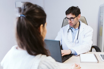 doctor male talking to patient female at the Doctors consult. Medical concept