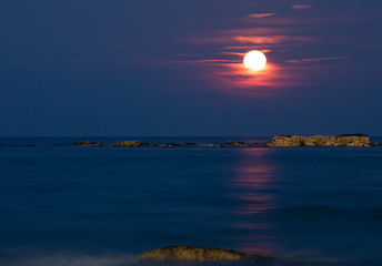 Shining Moon rise with reflection