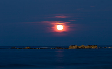 Fototapeta premium Shining Moon rise with reflection