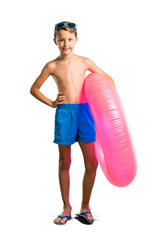 A full-length shot of Child on summer vacation posing with arms at hip on isolated white background
