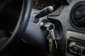 ignition key in the lock of an older car