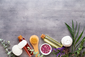 Spa treatment concept, flat lay composition with natural cosmetic products and massage brush, view from above, blank space for a text.