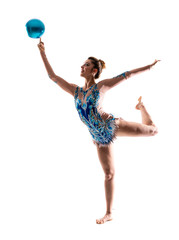 Girl doing rhythmic gymnastics with ball .
