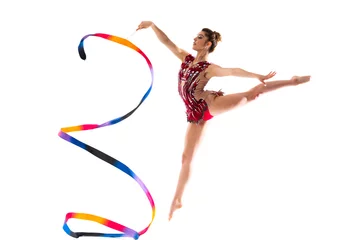 Fototapeten Girl doing rhythmic gymnastics with ribbon . jumping © luismolinero