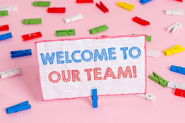 Text sign showing Welcome To Our Team. Business photo text introducing another demonstrating to your team mates Colored clothespin papers empty reminder pink floor background office pin