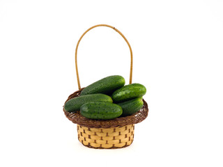 Cucumbers in a basket on a white background