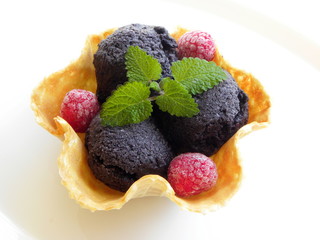 ice cream with fresh fruits in a waffle basket. berry ice cream