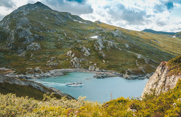 Boat rides on the lake in the Jotunheimen national park, mountains in the background a trip to Norway, truism in Northern Europe