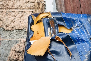 Close-up of a damaged leather furniture.