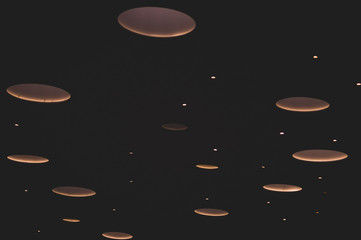 Sparkling lights on a black background. blinking lights abstract backdrop
