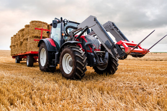 collecting straw bales after the harvest
