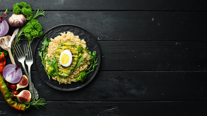 Boiled quinoa with avocado and spices. Menu. Free copy space. Top view.