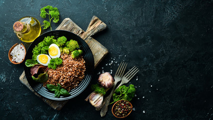 Boiled buckwheat with egg and broccoli. Dishes menu. Free copy space. Top view.