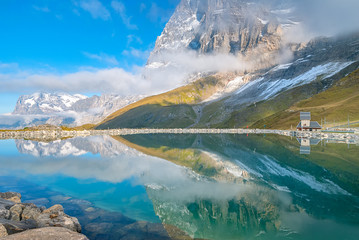 Fallbodensee lake with amazing mountain reflection in Jungfrau region, Switzerland