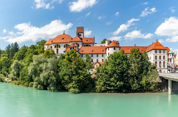 Fototapeta na wymiar High Palace and Saint Mang monastery in Fuessen on river Lech, Germany