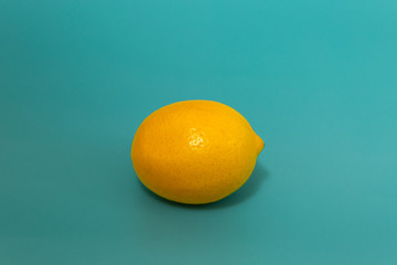 yellow lemon on blue background