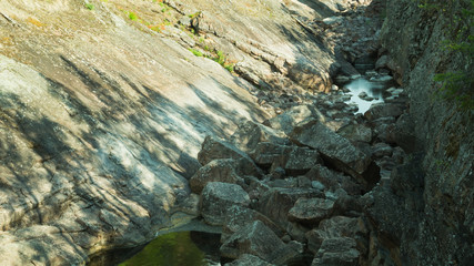 Rocky dry river. dry watercourse of the river with the rocks and water