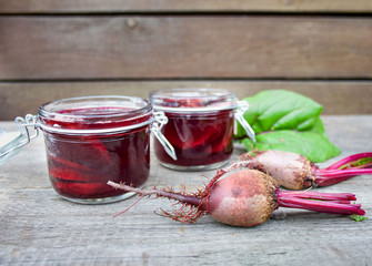 Beet leaven in jars on a background of gray boards