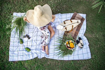 Summer picnic, girl with a plate of fruit