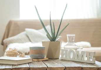 Home interior with decorative items on a wooden table.