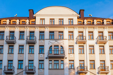 Fototapeta premium Front view of pale building in sunset light