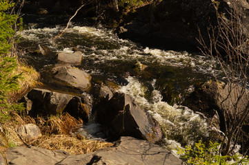 Waterfall background. rushing stream water. rocky flowing river