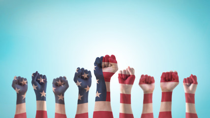 Labor day celebration concept with USA national flag on American people clenched fist hand...