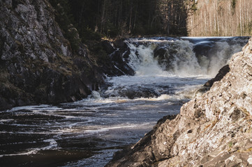 Waterfall background. rushing stream water. rocky flowing river
