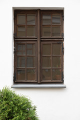 Dark wooden window from outside