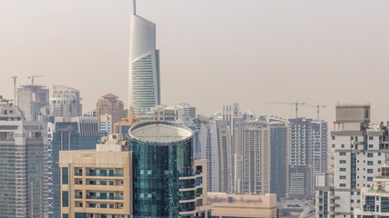 Aerial top view of Dubai Marina morning timelapse. Modern towers and traffic on the road