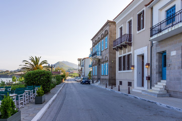 Fototapeta na wymiar Picturesque street on the waterfront of Myrina, Lemnos island, Greece