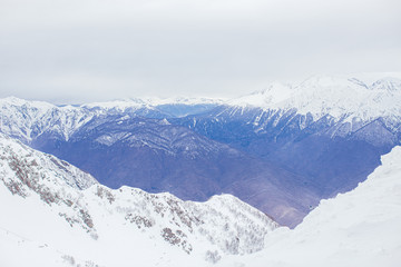Winter panorama view of mountains. Cold winter maille cloudy day in mountains